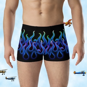 May include: Black boxer briefs with a blue and green flame design.