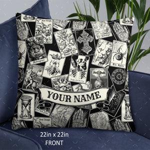 May include: Black and white throw pillow with a repeating pattern of tarot cards. The pillow has a banner with the text "YOUR NAME" in a white font. The pillow is 22 inches by 22 inches.