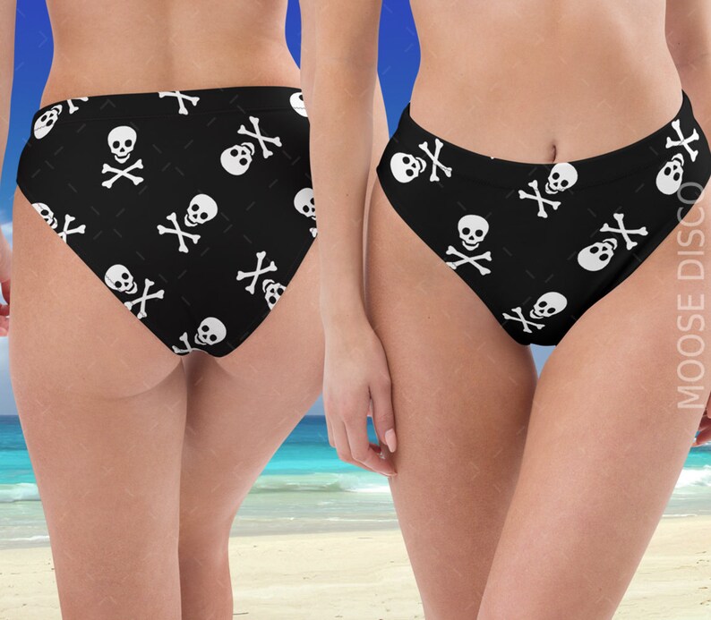 May include: Black bikini bottoms with a white skull and crossbones pattern.