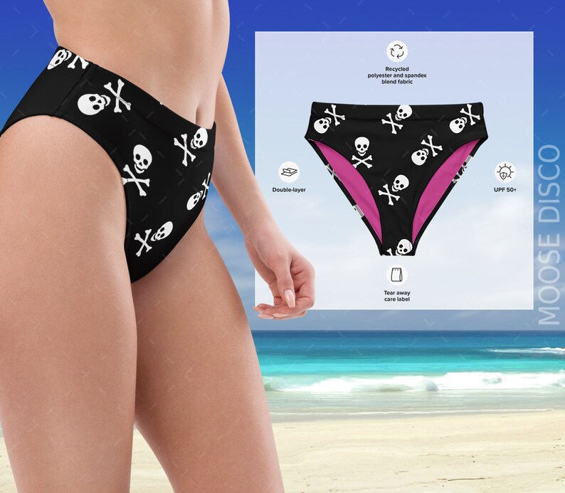 May include: Black high-waisted swimsuit bottom with a white skull and crossbones pattern. The swimsuit is double-layered and made from recycled polyester and spandex blend fabric. The fabric has a UPF 50+ rating.