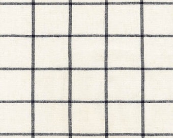 May include: Cream-colored fabric with a grid pattern of dark navy blue lines. The lines intersect to create evenly spaced squares. The fabric has a slightly textured appearance.