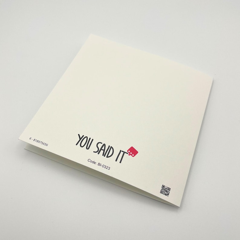 a close up of a book on a white surface