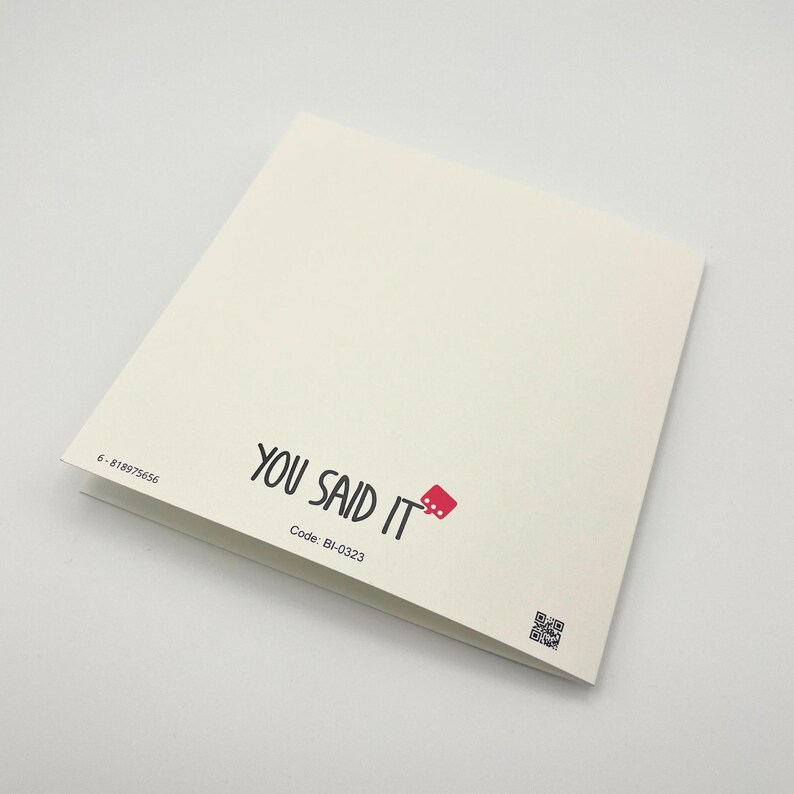 a close up of a book on a white surface