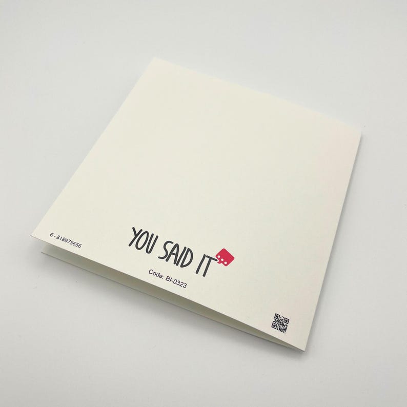 a close up of a book on a white surface