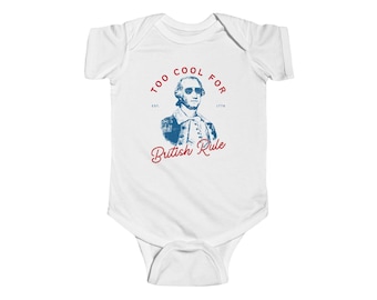 Body de manga corta unisex para bebé con el lema "Too Cool For British Rule" (IB652)