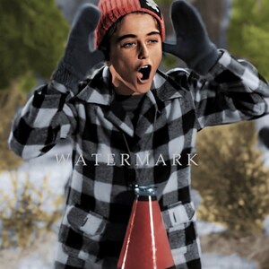 May include: A young person wearing a red and white plaid jacket, a red knit hat with a white star, and black gloves. The person is holding a red megaphone and has their mouth open as if they are shouting.