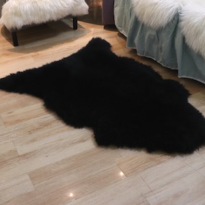 Woolous Black Sheepskin Rug - Luxurious Genuine New Zealand Sheep skin Rug Throw for Chair, Bedroom or Living Room Décor (2x3ft)