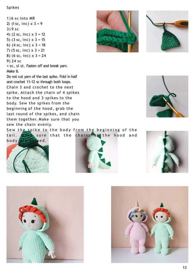 May include: Two crocheted dolls wearing green and pink dinosaur costumes. The dolls have red hair and are standing on a light pink surface. The dolls are wearing a green and pink dinosaur costume with a green tail and a green hood. The dolls are wearing a green and pink dinosaur costume with a green tail and a green hood.