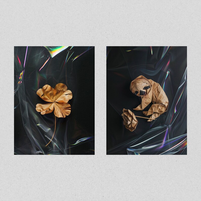 May include: Two images of origami art on a black background with iridescent plastic wrap. The first image shows a four-leaf clover made of brown paper. The second image shows a brown paper origami sloth holding a flower.