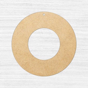May include: A plain, unfinished, round wooden wreath form with a hole at the top for hanging. The wreath form is made of natural wood and has a light brown colour.
