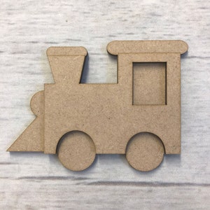 May include: A wooden train engine cutout with a square window and two wheels. The cutout is brown and has a simple design.