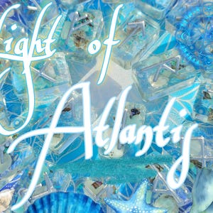 May include: An artistic composition featuring the text "Light of Atlantis" in white script over a backdrop of blue and turquoise resin blocks. The image includes seashells, starfish, and a compass design.