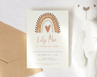 May include: A colorful rainbow birthday invitation with a heart in the center. The invitation is for Lily Mae's first birthday party. The text reads "Lily Mae is turning one!" and includes the date and time of the party.