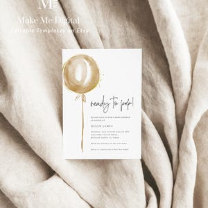 May include: A white baby shower invitation with a gold balloon illustration and the text "ready to pop!" Please join us for a baby shower in honour of Helen James. Tuesday, 24th August 2022 at 5pm. 2129 John Calvin Drive, Buffalo Grove, IL 60089. RSVP to Jessica at 555-555-5555. Helen is registered at Buy Buy Baby.