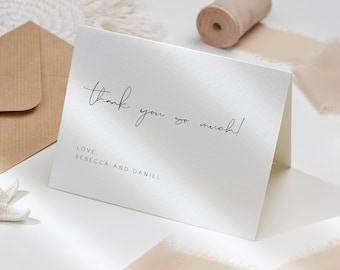 May include: White thank you card with black calligraphy that says "thank you so much!" and "LOVE, REBECCA AND DANIEL" in a simple font.