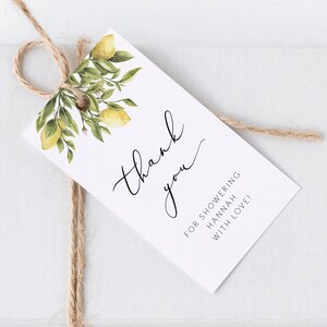 May include: Thank you for showering Hannah with love!  A white card with black text and a watercolor illustration of lemon branches.