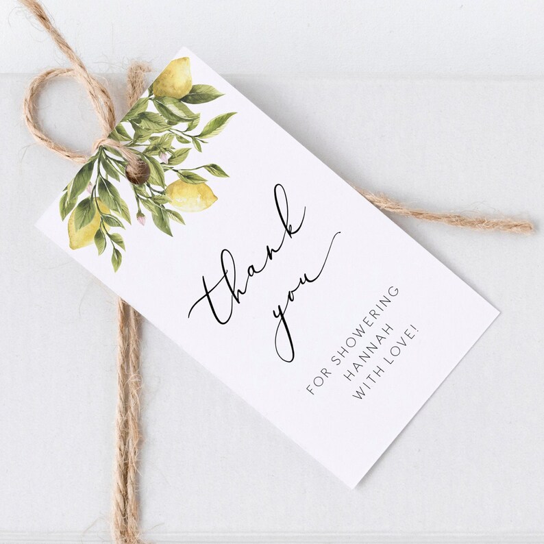May include: Thank you for showering Hannah with love!  A white card with black text and a watercolor illustration of lemon branches.