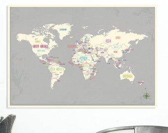 May include: A world map print with a gray background and a cream-colored border. Country names are labeled in various colors. A compass rose is in the lower right corner. The map is a decorative piece.