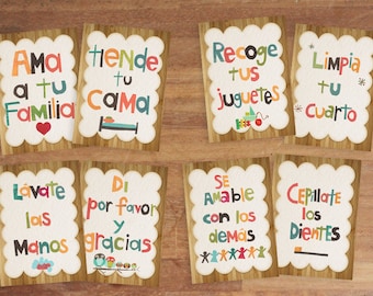 May include: Set of eight colorful cards with scalloped edges and wooden backgrounds. Each card features a different phrase in Spanish, such as "Love your family" and "Brush your teeth." The text is in various bright colors.
