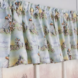 May include: A light blue and yellow valance with a floral pattern and the text "Easter Blessings" repeated throughout.