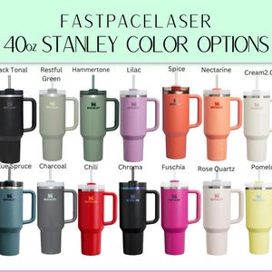 a collection of 40 oz Stanley color options, including black, green, purple, orange, pink, blue, red, and yellow.