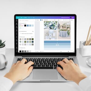 May include: A person using a laptop computer to create a wedding mood board. The screen shows a collage of images with a color palette of blue and gray. The laptop is on a white desk with a plant, headphones, and a cup of coffee.