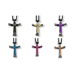 May include: Six different colored horseshoe cross necklaces. The crosses are made of silver horseshoe nails and are wrapped with different colored wire. The necklaces are all on black cords.