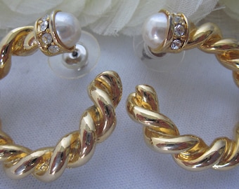 May include: A pair of gold-tone twisted hoop earrings with a faux pearl and clear rhinestone accents.