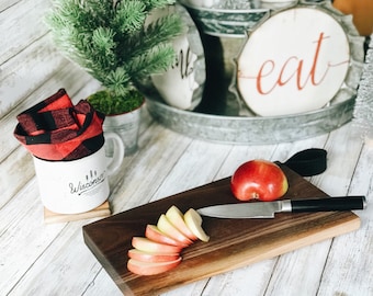 7x12 Monona Style Handcrafted Walnut Serving Board with Live Edge and Leather Loop handle.