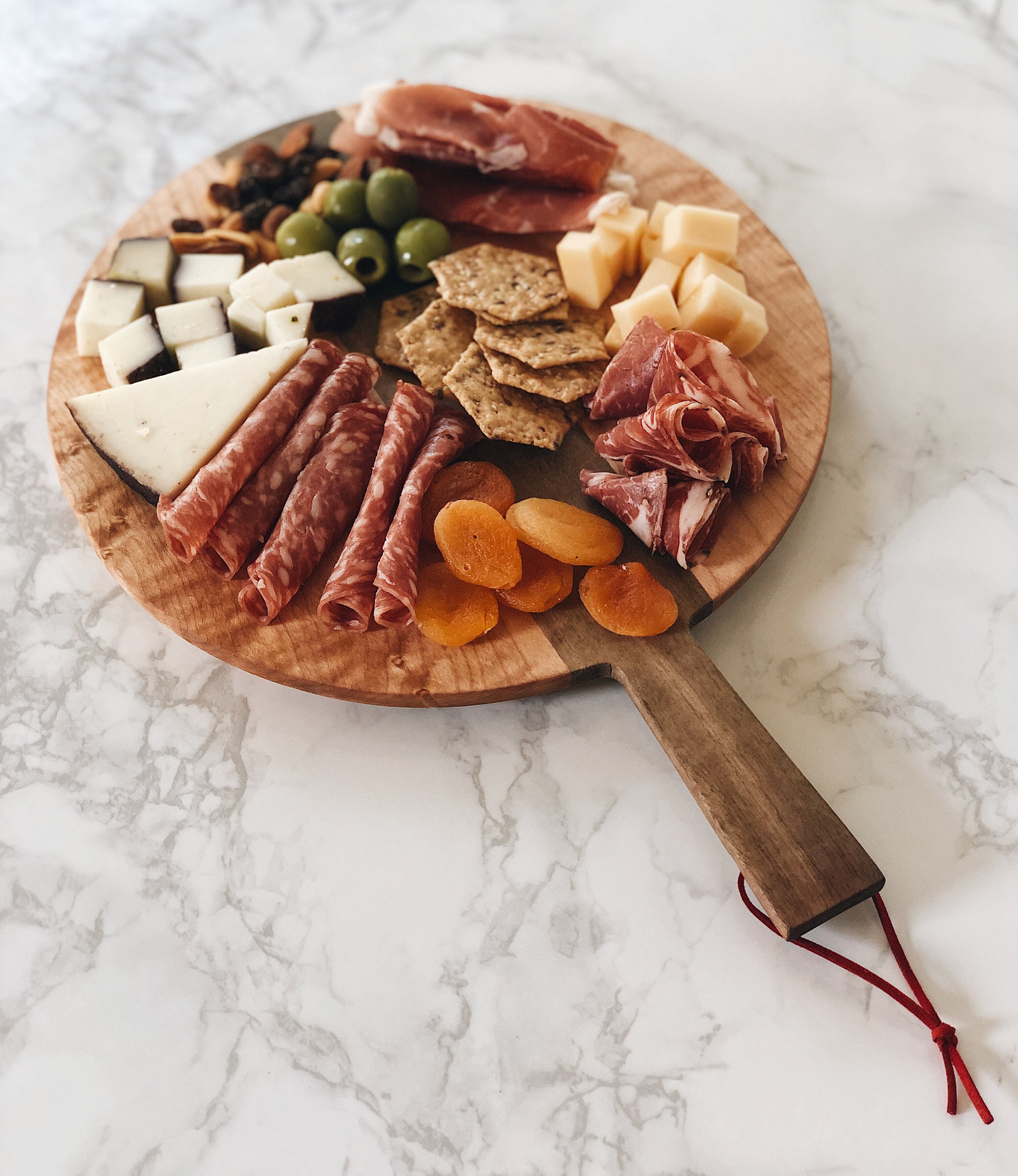 Round Charcuterie Board w/ handle and leather loop made from Etsy