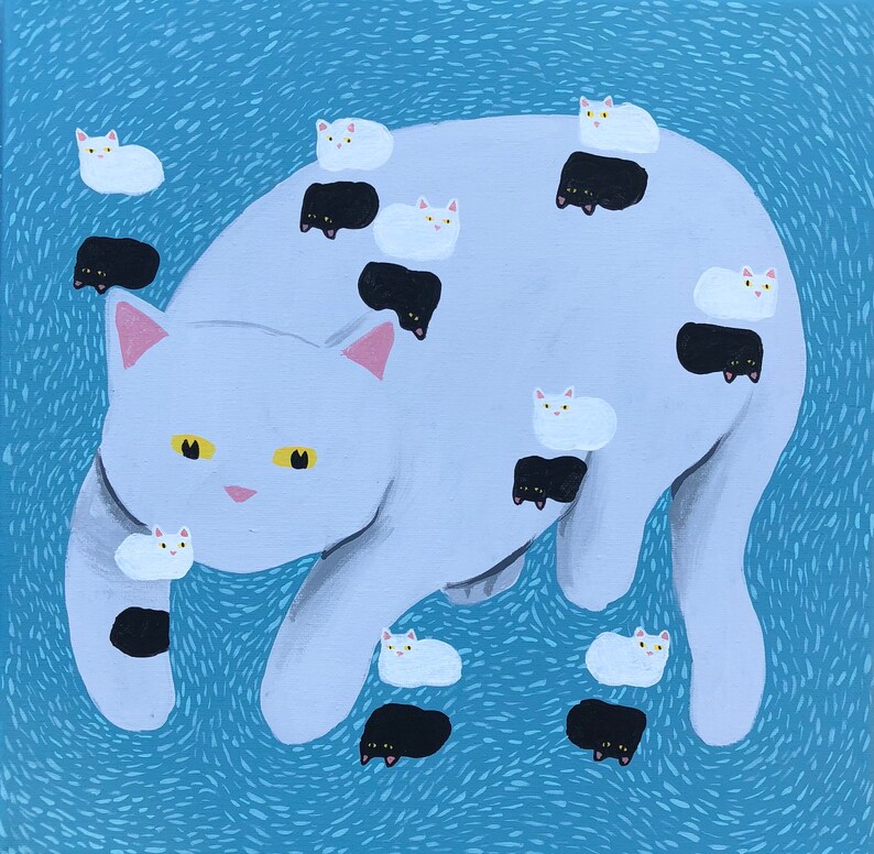 May include: A white cat with black and white spots is surrounded by smaller white cats with black spots. The larger cat is lying on its side with its head turned to the side. The smaller cats are scattered around the larger cat.