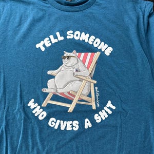 Tell Someone Who… - Turquoise T-shirt image 1