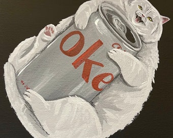 May include: A white cat holding a silver can with the word "Oke" printed in red letters.