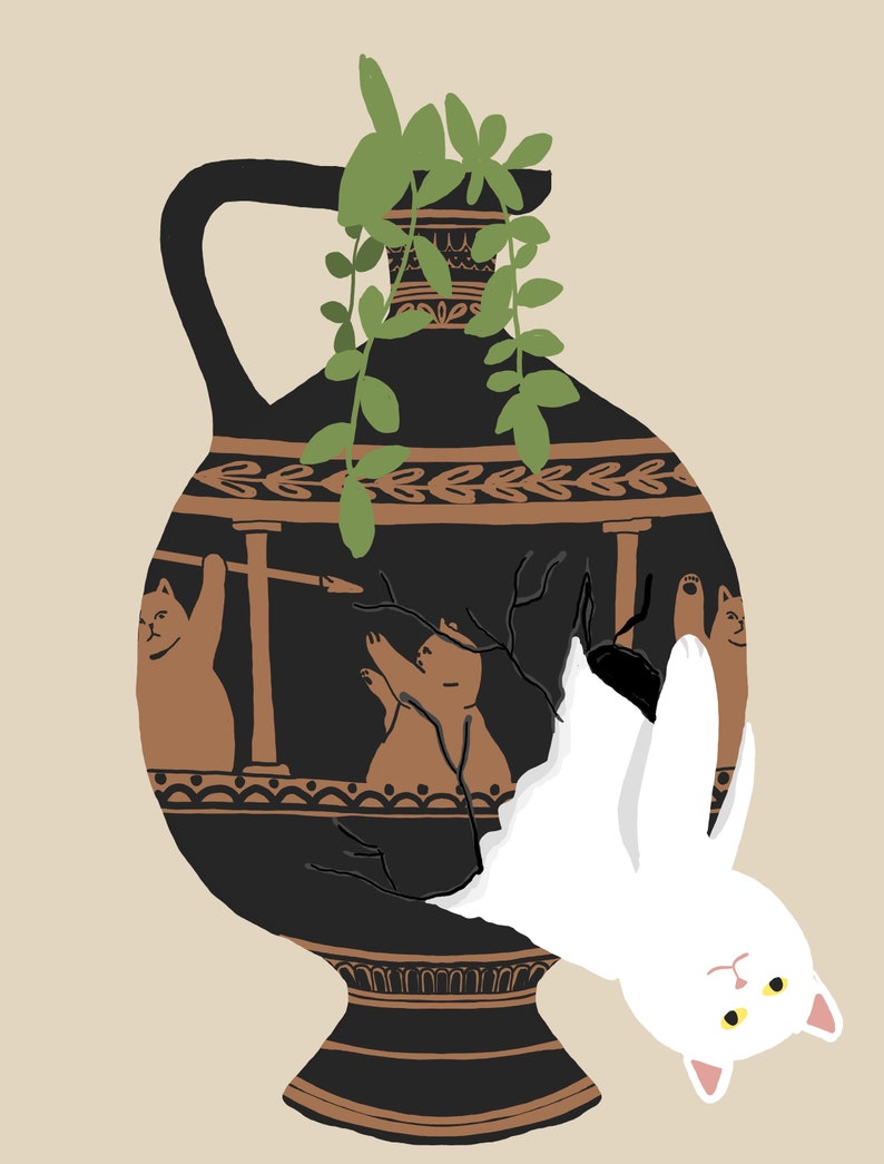 May include: A black and brown ceramic vase with a white cat hanging upside down out of a crack in the side. The vase has a design of two brown cats and a bear on it. There are green plants growing out of the top of the vase.