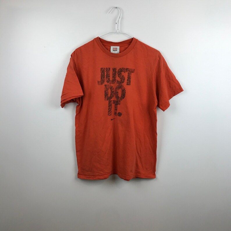 orange nike just do it shirt
