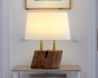 Table lamp, walnut base with two blown brass axes