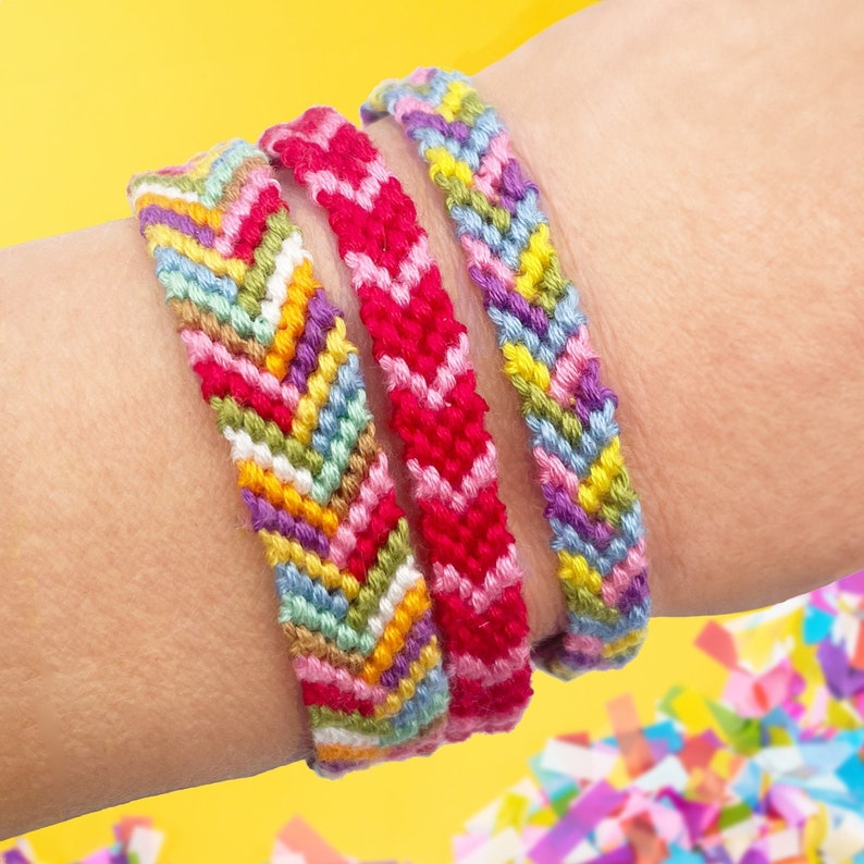 Handmade friendship bracelets in rainbow colours, worn on a wrist. DIY bracelet making kit for beginners, craft lovers, and gifts.