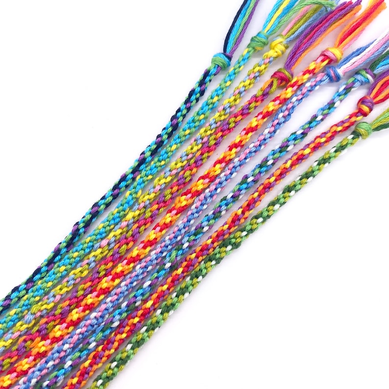 A bundle of smooth, colourful threads ready for weaving. The kit comes with 48m of cord in 12 bright shades, pre-cut and ready to use — just pick your colours and get braiding.