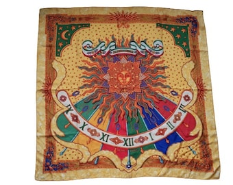 May include: A square silk scarf with a sun and clock face design. The scarf features a central sun with a face, surrounded by rays and a colorful clock face. The border is a light brown with decorative elements. The scarf has a vintage aesthetic.