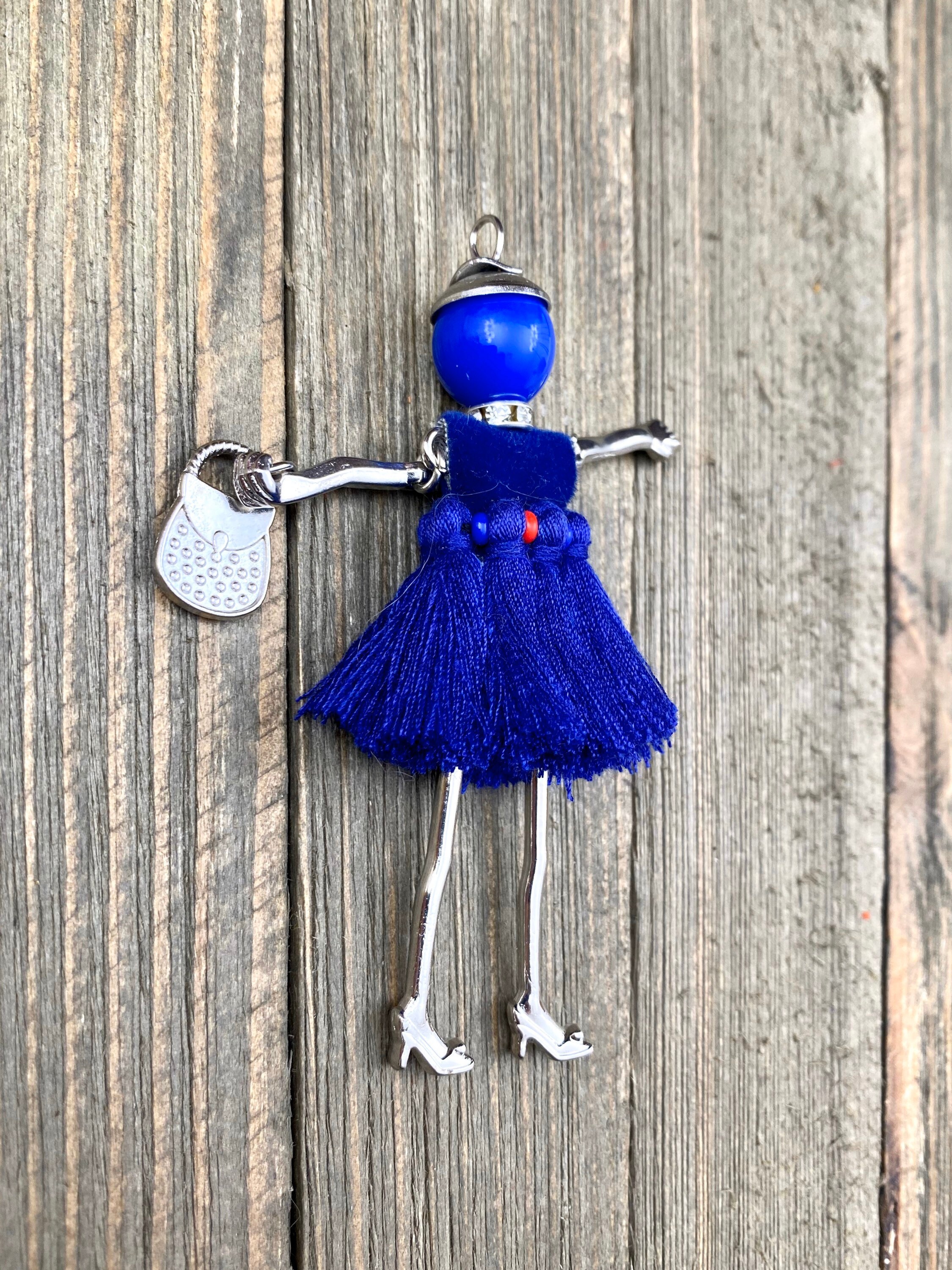 Collana in Metallo con campanella smaltata blu e perline – Group S.r.l