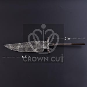 May include: A dark metal knife blade with a floral pattern, measuring 6.5 inches long. The handle is 5 inches long. The text "CROWN CUT" is visible. The knife is set against a dark background.