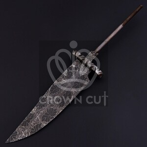 May include: A large, ornate sword with a wide, leaf-patterned blade. The metal has a dark, aged appearance. The handle is a simple, textured rod. The sword's design suggests a historical or fantasy theme.