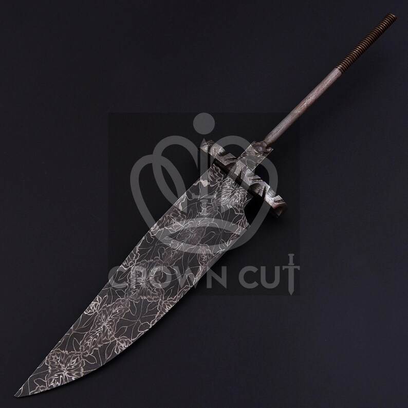 May include: A large, ornate sword with a wide, leaf-patterned blade. The metal has a dark, aged appearance. The handle is a simple, textured rod. The sword's design suggests a historical or fantasy theme.