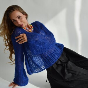 Blue see-through sweater with V neck and balloon sleeves