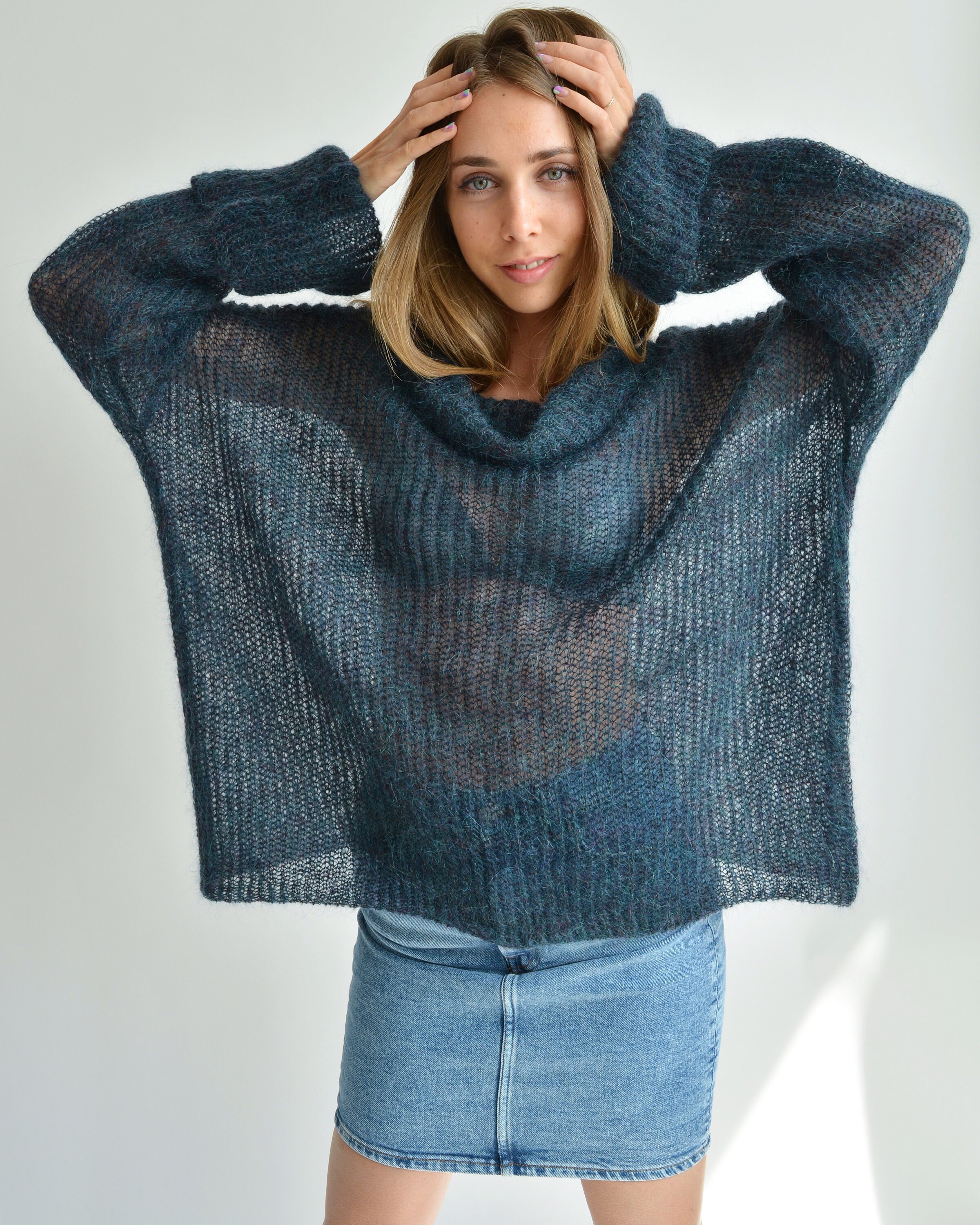 Brown and blue heathered chunky knitted turtleneck and flared sleeve sweater