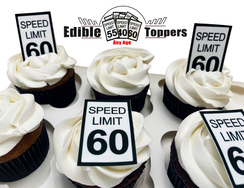 May include: Six cupcakes decorated with white frosting and edible speed limit signs that say "Speed Limit 60". The cupcakes are in a white cupcake holder. The image also includes a logo that says "Edible Toppers" and "Any Age".