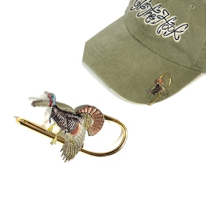 Turkey Hookit© Hat Hook - Hat Clip - Brim Clip - Money Clip -The most entertaining hunting there is.