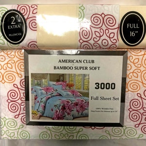 May include: A package of a full size 3000 thread count sheet set made with bamboo. The sheet set is wrinkle free and has a deep pocket that fits mattresses up to 16 inches. The package features a floral design with a light blue background and pink flowers. The package also includes two extra pillowcases.