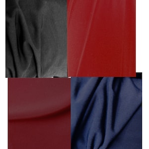 May include: Four fabric swatches in different colors: black, red, burgundy, and navy blue. The fabric is smooth and has a slight sheen.