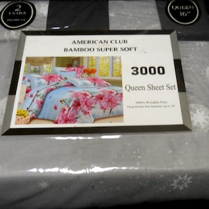 May include: A gray queen-sized sheet set with a floral pattern. The packaging includes two extra pillowcases. The sheet set is made of bamboo and is wrinkle-free. The packaging also says "American Club Bamboo Super Soft 3000 Queen Sheet Set".